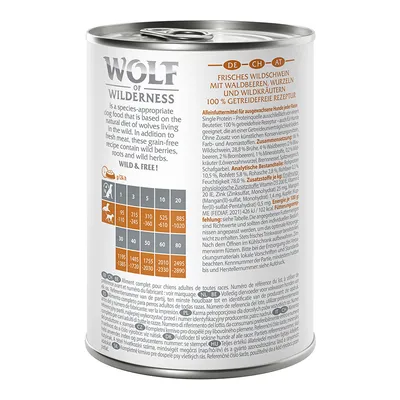 Wolf of Wilderness wet food can. Fresh wild boar with forest berries, roots and wild herbs. 100% grain-free recipe. Feeding table for dogs by weight visible.