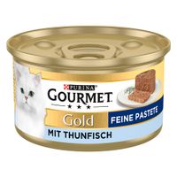 Purina Gourmet Gold Fine Paté con tonno, cibo in lattina per gatti dorata con immagine di un gatto bianco e paté servito.
