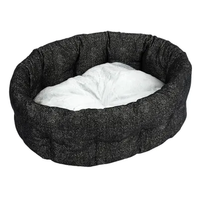 Letto per animali rotondo e nero con imbottitura morbida e bianca. Adatto per comfort e riposo.