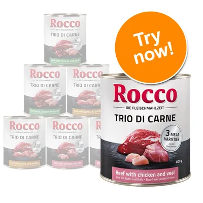Rocco Trio di Carne 800g tins, visible text: 3 meat varieties, Beef with chicken and veal. Orange badge reads: Try now!