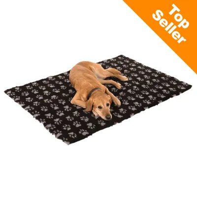 Hund ligger på sort tæppe med grå poteaftryk. Orange hjørnefelt med teksten 'Top Seller'.