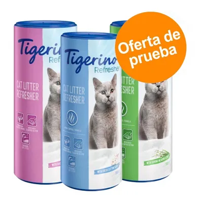 Tigerino Refresher Cat Litter Refresher, envases rosa, azul y verde con imagen de gato. Texto visible: 'Oferta de prueba', 'with baby powder scent', 'with fresh cotton scent', 'with spring meadow scent'.