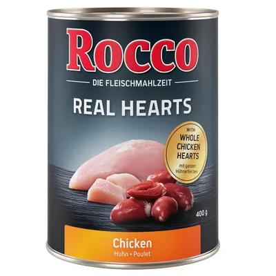 Blik Rocco Real Hearts hondenvoer, kipvariant, 400 g. Tekst: 'Die Fleischmahlzeit', 'with whole chicken hearts', 'Chicken Huhn Poulet'. Afbeelding van kipfilet en kippenharten.