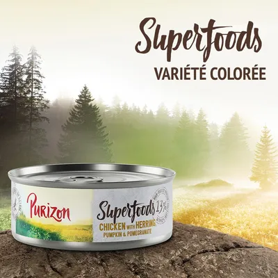 Boîte Purizon Superfoods 13 %, poulet avec hareng, citrouille et grenade. Texte visible : Superfoods variété colorée. Emballage métallique.