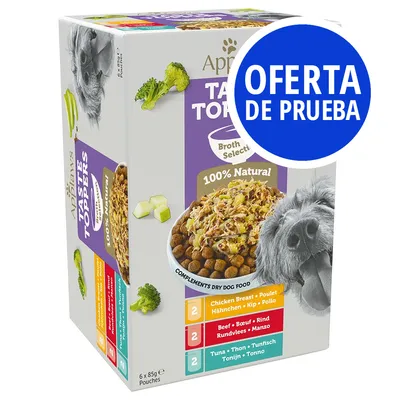 Caja de Applaws Taste Toppers para perros, 6 sobres de 85 g. Variedades: pollo, ternera y atún. Texto visible: '100% Natural', 'OFERTA DE PRUEBA'. Imagen de comida y perro en el envase.
