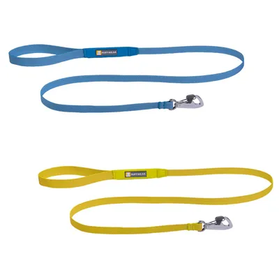 Two Ruffwear fabric dog leads, one blue and one yellow, each with a metal clip and visible Ruffwear brand label on the handle loop. Two Ruffwear fabric dog leads, one blue and one yellow, each with a metal clip and visible Ruffwear brand label on the handle loop.