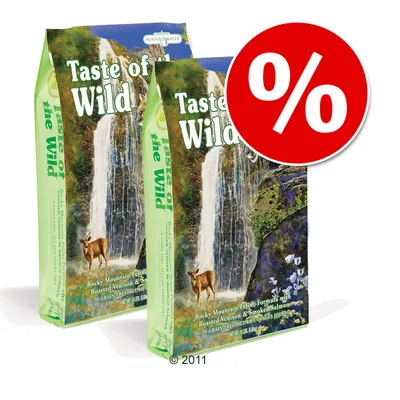 Două pungi Taste of the Wild Rocky Mountain Feline Formula with Roasted Venison & Smoked Salmon, semn procent roșu pentru promoție vizibil pe ambalaj. Două pungi Taste of the Wild Rocky Mountain Feline Formula with Roasted Venison & Smoked Salmon, semn procent roșu pentru promoție vizibil pe ambalaj.