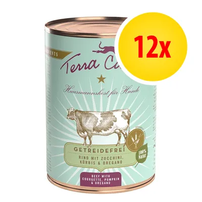 Confezione da 12x Terra Canis, alimento per cani senza cereali, manzo con zucchine, zucca e origano. Testo visibile: '100% Natur', 'Beef with courgette, pumpkin & oregano'.