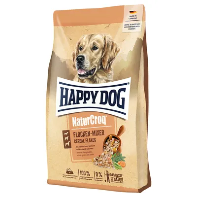 Συσκευασία Happy Dog NaturCroq Flocken-Mixer Cereal Flakes με εικόνα σκύλου, δημητριακά και λαχανικά. Ορατό κείμενο: 100 %, 0 %, Das Beste der Natur, Made in Germany.