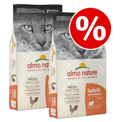 Two bags of Almo Nature holistic maintenance dry food with fresh chicken, 12kg each, adult cat formula. Red percentage discount symbol shown in corner.