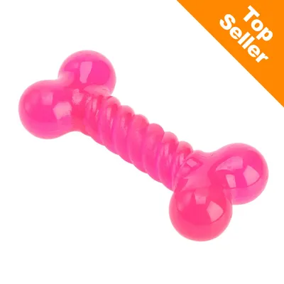 Jouet en forme d’os, plastique rose, mention « Top Seller » en haut à droite sur fond orange.