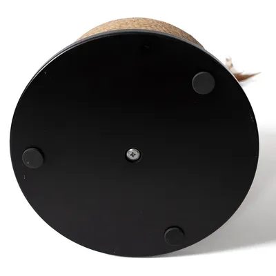 Round black base with four non-slip rubber feet and central screw, part of a scratching post accessory.