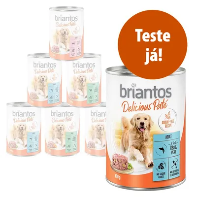 Várias latas de briantos Delicious Paté, receita sem cereais para adulto, variedade White Fish & Peas, 400 g. Texto visível: 'Teste já!'. Rótulo indica ausência de açúcar e aromatizantes artificiais.