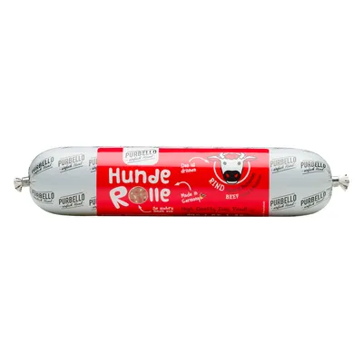 Saucisse pour chien PURBELLO Hunde Rolle, étiquette rouge avec texte allemand et anglais : Rind, Beef, Made in Germany, High Quality Dog Food. Illustration de vache visible.