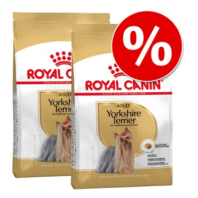 Две опаковки Royal Canin Adult Yorkshire Terrier с изображение на йоркширски териер и голям червен символ за процентно намаление върху едната опаковка. Две опаковки Royal Canin Adult Yorkshire Terrier с изображение на йоркширски териер и голям червен символ за процентно намаление върху едната опаковка.
