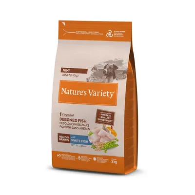 Saco de 3 kg de pienso Nature's Variety Mini Adult (1–10 kg), pescado sin espinas, con cereales integrales y pescado blanco. Texto visible: proteína, calidad, digestibilidad.