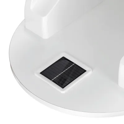 Close-up of a white product with integrated solar panel. Energy generation function visible.