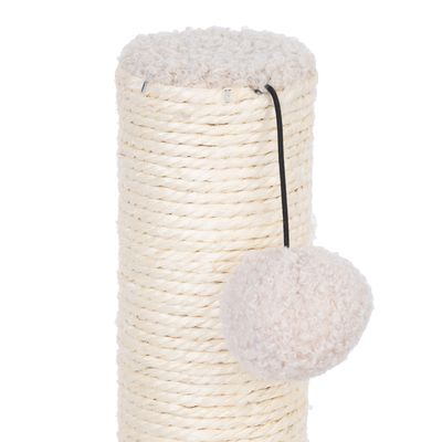 Tronc à griffer en corde de sisal beige avec boule en tissu suspendue par un cordon noir, dessus recouvert de tissu bouclé clair.