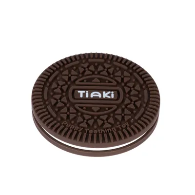 Tiaki Puppy Teething Toy em forma de bolacha castanha, desenvolvido especialmente para cachorros.