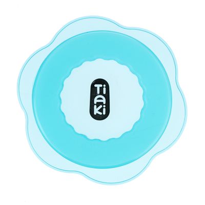 Tiaki. Ronde, blauwe siliconen afdekking met golvende rand.