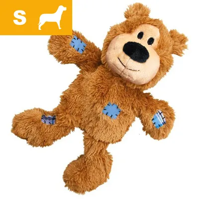 Brunt plyslegetøj formet som bamse med blå lapper på arme, ben og mave. Gul felt med hvidt S og hundesilhuet øverst til venstre indikerer størrelse small til hund. Brunt plyslegetøj formet som bamse med blå lapper på arme, ben og mave. Gul felt med hvidt S og hundesilhuet øverst til venstre indikerer størrelse small til hund.