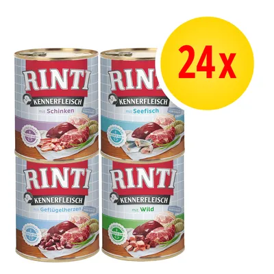 RINTI Kennerfleisch 24x puszki: mit Schinken, mit Seefisch, mit Geflügelherzen, mit Wild. Widoczne opakowania z mięsem i rybą na etykietach.
