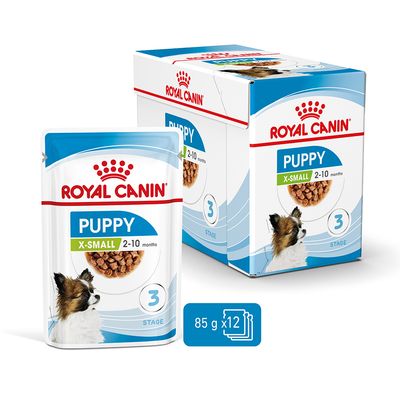 Royal Canin Puppy X-Small, 2–10 měsíců, 3. stupeň, 85 g x 12 sáčků. Viditelný obal a produkt s obrázkem psa.