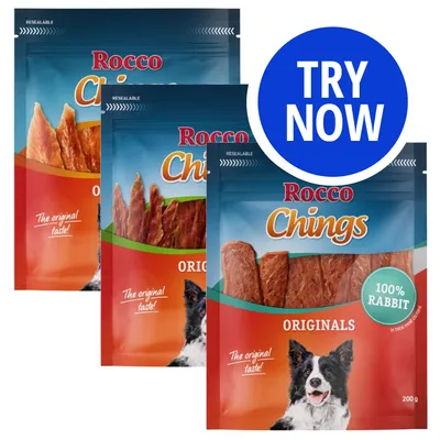 Three packs of Rocco Chings Originals with visible text '100% rabbit', 'The original taste!' and a blue circle stating 'TRY NOW'. Three packs of Rocco Chings Originals with visible text '100% rabbit', 'The original taste!' and a blue circle stating 'TRY NOW'.