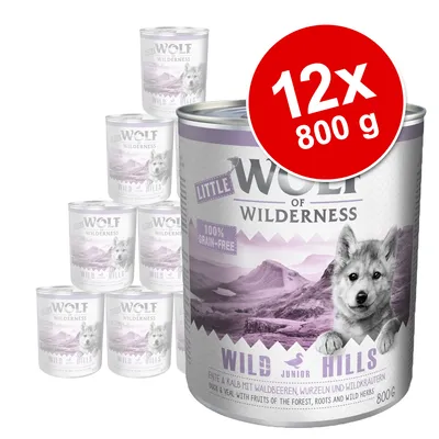 Wolf of Wilderness Little Wild Hills -koiran märkäruoka, 12 x 800 g. Pakkauksessa maininta: 100% grain-free. Tuotenimi ja määrä näkyvissä purkeissa.