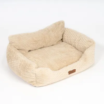 Panier rectangulaire beige en tissu doux à rebords hauts, étiquette marron visible sur le devant. Aucun animal ni accessoire présent.
