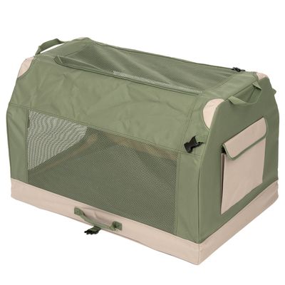Transportní box ze zelené látky se síťovanými okny, nosnými uchy a boční kapsou. Vhodný pro přepravu domácích zvířat.