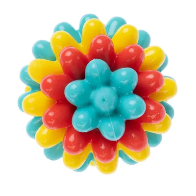 Minge de jucărie colorată din plastic cu elemente roșii, galbene și albastre în formă de floare.