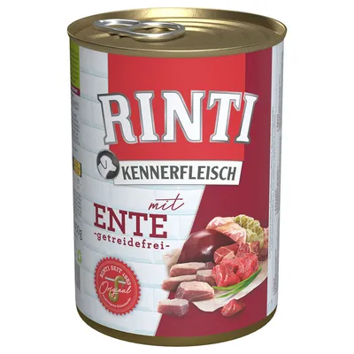 RINTI Kennerfleisch mit Ente -getreidefrei- koiran märkäruokapurkki, kannessa vetorenkki, etiketissä lihapaloja ja vihanneksia, saksankielinen teksti.