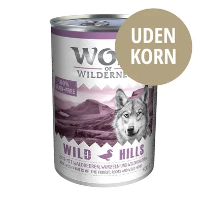 Wolf of Wilderness Wild Hills dåse 400 g, 100% grain-free, uden korn. Synlig tekst: 'ENTE MIT WALDBEEREN, WURZELN UND WILDKRÄUTERN'. Billede af ulvehoved. Wolf of Wilderness Wild Hills dåse 400 g, 100% grain-free, uden korn. Synlig tekst: 'ENTE MIT WALDBEEREN, WURZELN UND WILDKRÄUTERN'. Billede af ulvehoved.
