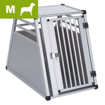 Transporter dla psa z metalu i tworzywa, rozmiar M widoczny w lewym górnym rogu na zielonym tle, drzwiczki z kratą i zamkiem.