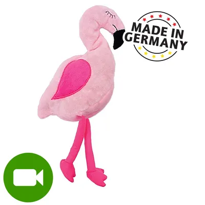Pluszowa zabawka w kształcie flaminga, różowy materiał, widoczny napis MADE IN GERMANY. Ikona wideo w lewym dolnym rogu.