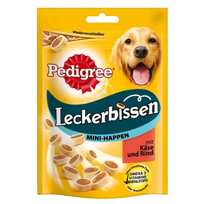 Pedigree Leckerbissen MINI-HAPPEN mit Käse und Rind -koiranherkkupussi, Omega 3, vitamiineja ja kivennäisaineita. Saksankielinen pakkaus, kuvassa koira ja herkkupaloja.