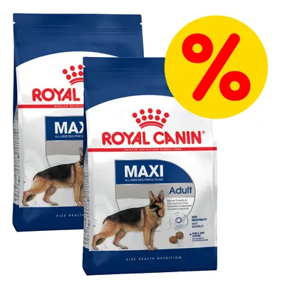 Dwie torby karmy Royal Canin Maxi Adult z widocznym psem rasy owczarek niemiecki i żółtym symbolem procenta, oznaczającym promocję lub ofertę specjalną.