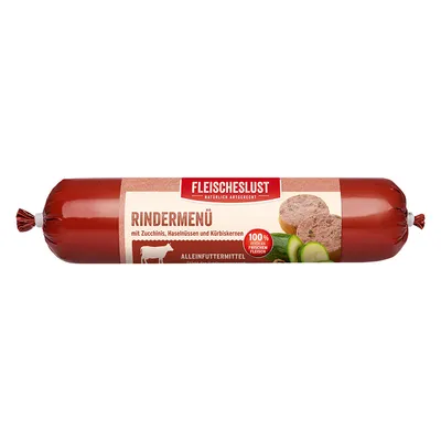 Fleischeslust Rindermenü, napis: mit Zucchinis, Haselnüssen und Kürbiskernen, 100 % aus frischem Fleisch. Na embalaži so slike bučk in rezine izdelka.