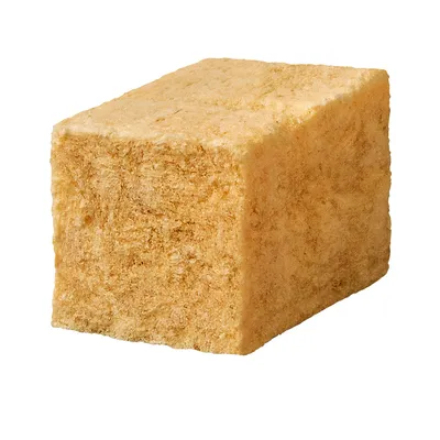 Keltainen kuutio puristetusta materiaalista, mahdollisesti eläinten välipala tai mineraalilohko.
