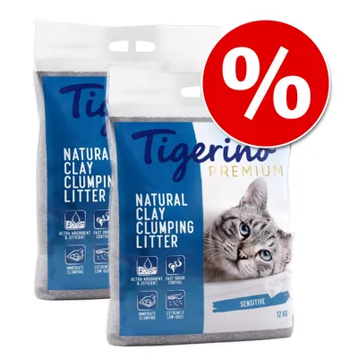 Dwa worki Tigerino Premium Natural Clay Clumping Litter Sensitive 12 kg, widoczny kot i piktogramy: ultra chłonność, kontrola zapachu, szybkie zbrylanie, niska pylistość. Symbol promocji %.