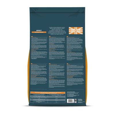 Back of pet food bag showing feeding guide, nutritional information, ingredients list, and a label stating 'Made in the UK'.