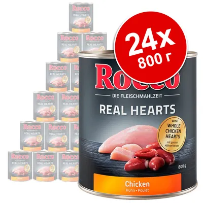 Rocco Real Hearts Chicken, 24 консерви по 800 г. Видими са парчета пилешко месо и сърца на етикета. Надпис: with whole chicken hearts. Голям червен кръг с текст: 24x 800 г.