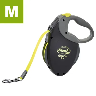 Flexi Giant M 8 m -kelatalutin, musta-keltainen, näkyvissä Flexi-logo ja teksti 'Giant M 8m', koko M merkitty vihreällä laatikolla vasemmassa yläkulmassa.