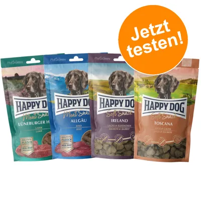 Happy Dog Meat Snack in vier Sorten: Lüneburger Heide (Lamm), Allgäu (Rind), Ireland (Lachs & Kaninchen), Toscana (Ente & Lachs). Orange Kreis mit Text 'Jetzt testen!'.