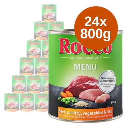 Rocco Menu, 24 puszki po 800 g. Widoczne składniki: wołowina, drób, warzywa i ryż. Napis: enriched with carbohydrates. Opakowanie zielone z ilustracją mięsa i warzyw.
