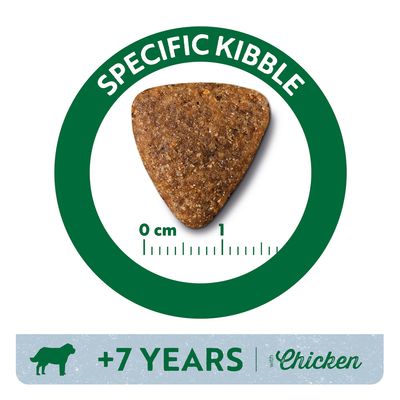 Triangle-shaped kibble with text: SPECIFIC KIBBLE. Size scale 0–1 cm shown. Banner below reads: +7 YEARS with Chicken, dog silhouette visible.