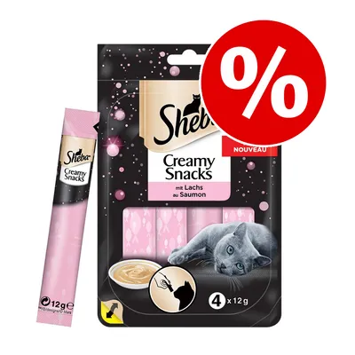 Sheba Creamy Snacks mit Lachs au Saumon, 4 x 12 g. Pakkauksessa vaaleanpunaisia annospusseja, kuvassa harmaa kissa ja punainen prosenttimerkki tarjouksesta.