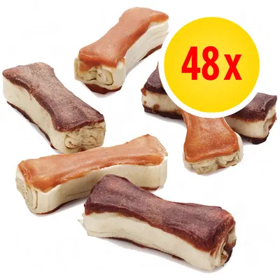 48 kpl puruluuluita, kaksi eri väriä, luun muotoisia. Keltainen ympyrä, jossa punainen teksti: 48x. 48 kpl puruluuluita, kaksi eri väriä, luun muotoisia. Keltainen ympyrä, jossa punainen teksti: 48x.