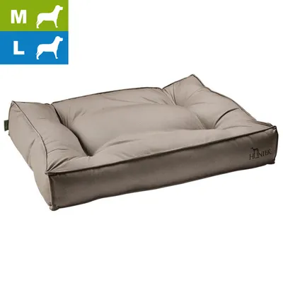 Coussin pour chien Hunter, tissu beige, tailles M et L indiquées en haut à gauche, logo Hunter visible sur le côté du coussin.